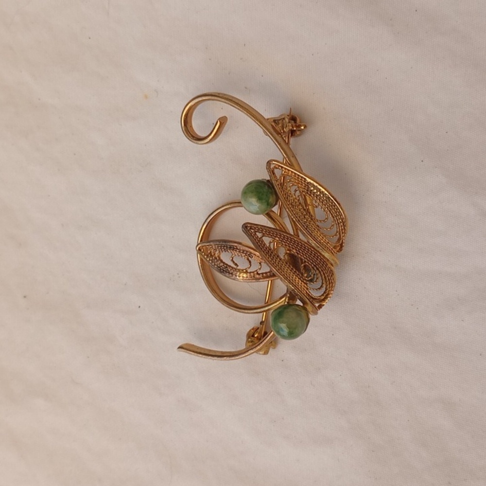 Vintage Gold-toned Filigree Brooch adorned with rounded green jade stones